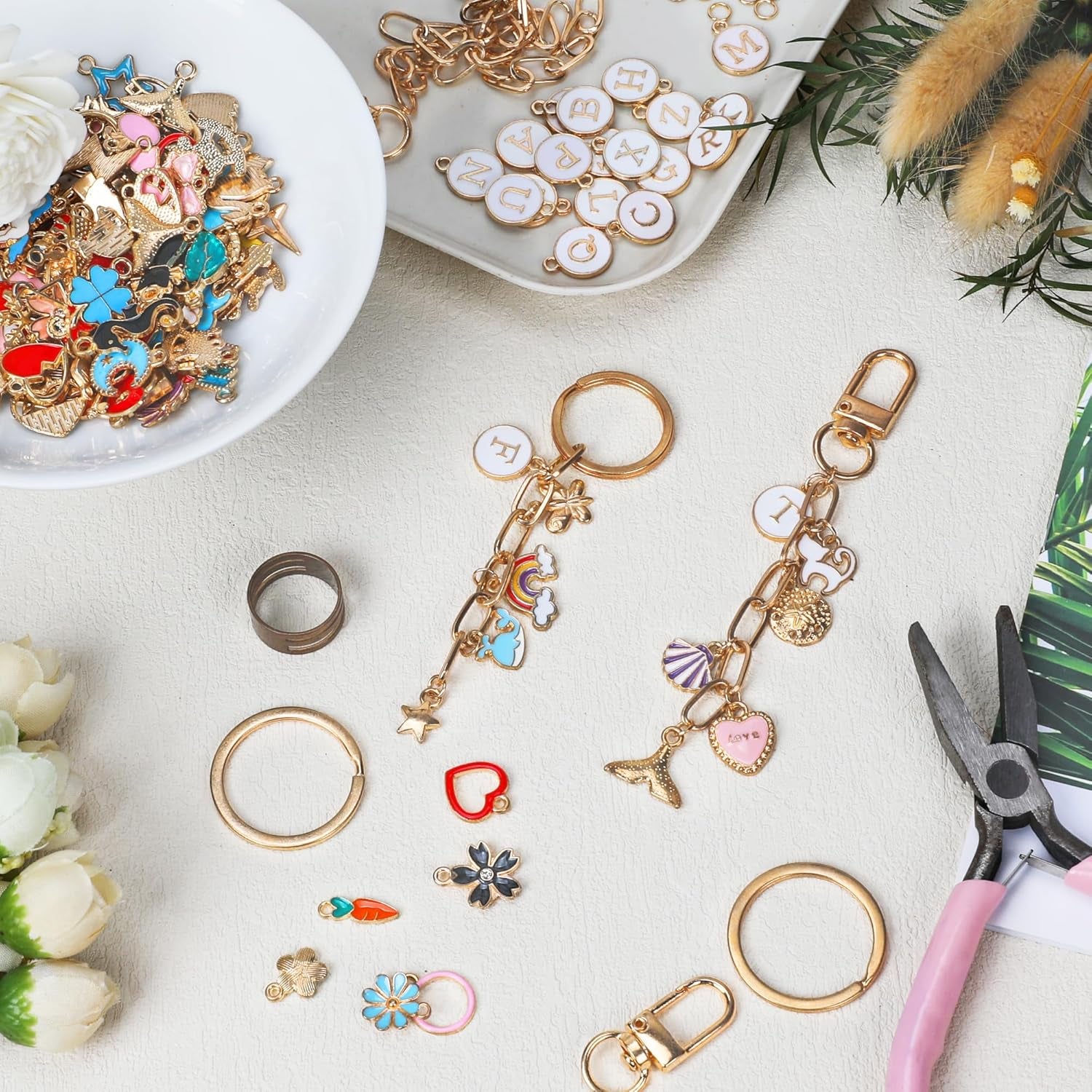 223Pcs Keychain Making Kit Bag Charm Kit 86 Charms 10 Keychain Clips with Key Ring Jewelry Plier,15 Extender Chain Swivel Snap Hooks Gold Charms 100 Jump Ring DIY Craft Supplies